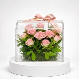Composition de roses roses en coffret transparent 42